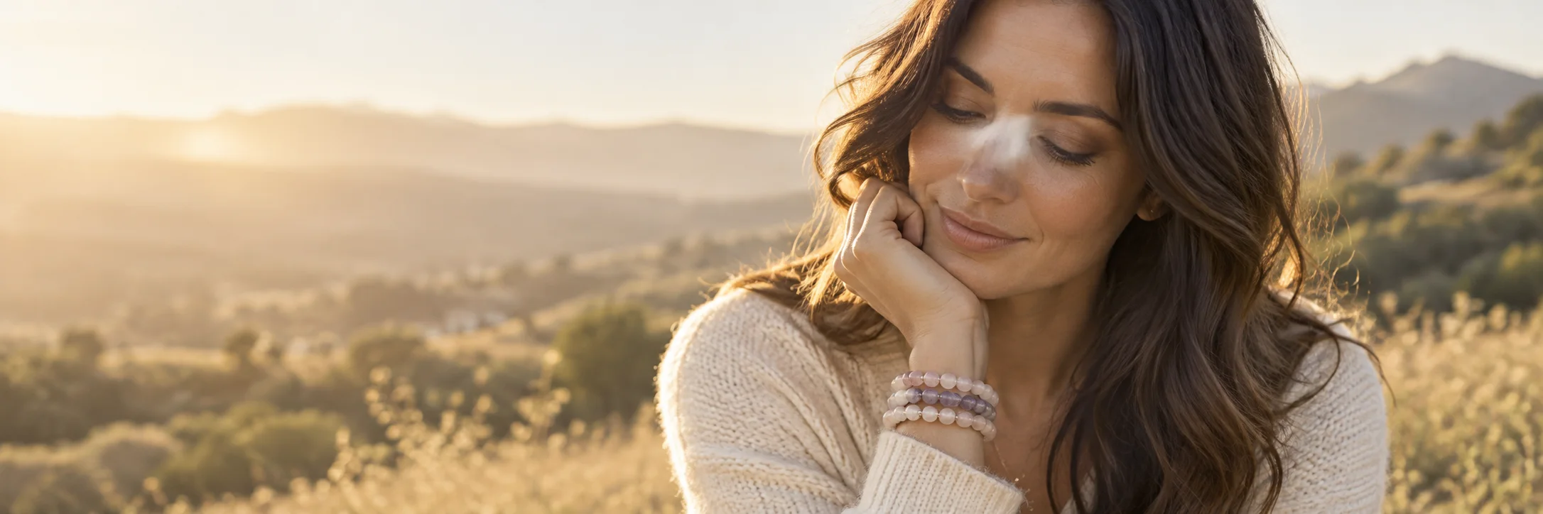 Illustrative bracelet styling on a wrist in warm evening light